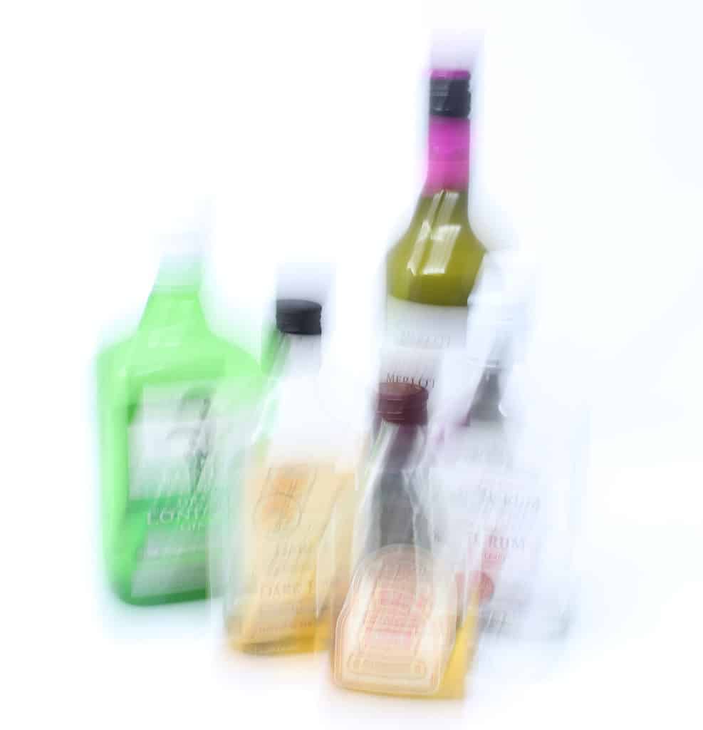 What is Shutter Speed in Photography? Alcohol bottles photo shown with camera shake.