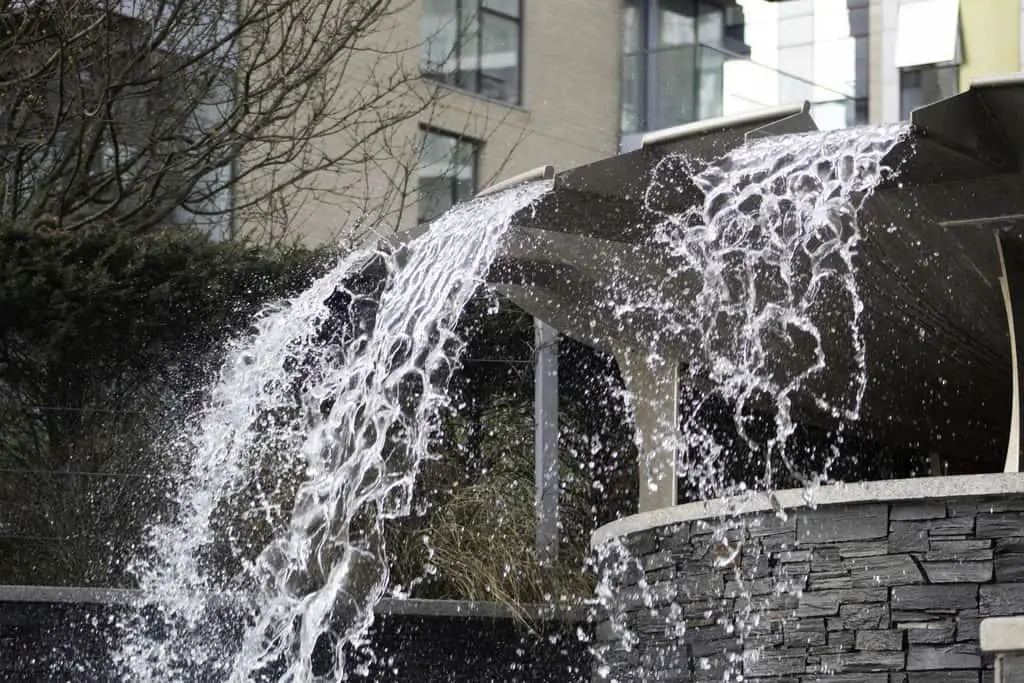 What is Shutter Speed in Photography? Waterfall fountain showing water frozen by a fast shutter speed.