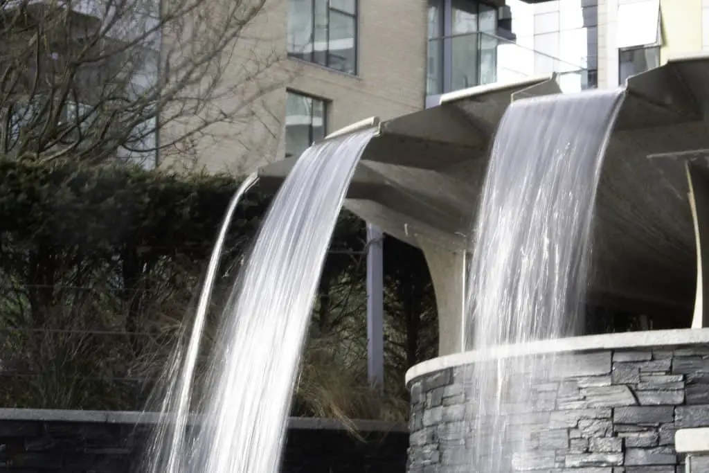 What is Shutter Speed in Photography? Waterfall fountain showing water blurred by a slow shutter speed.