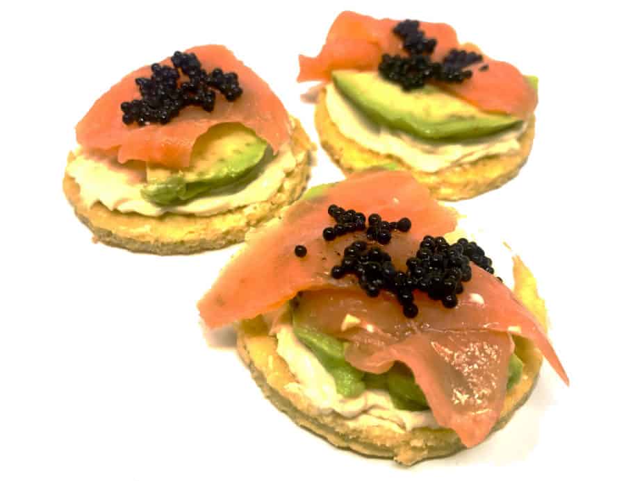 What is Composition in Photography? Three smoked salmon blinis with avocado and caviar.