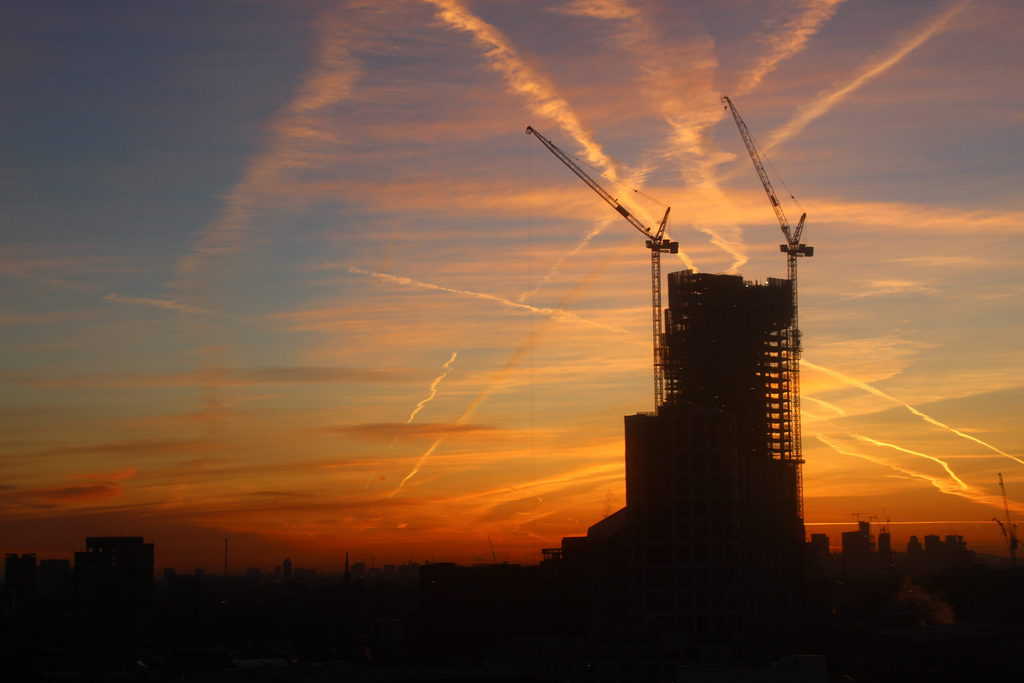What is The Golden Hour in Photography? Golden contrails in the sky.