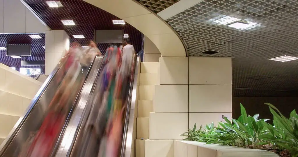 How to Capture Motion Blur in Photography! People on a moving escalator.