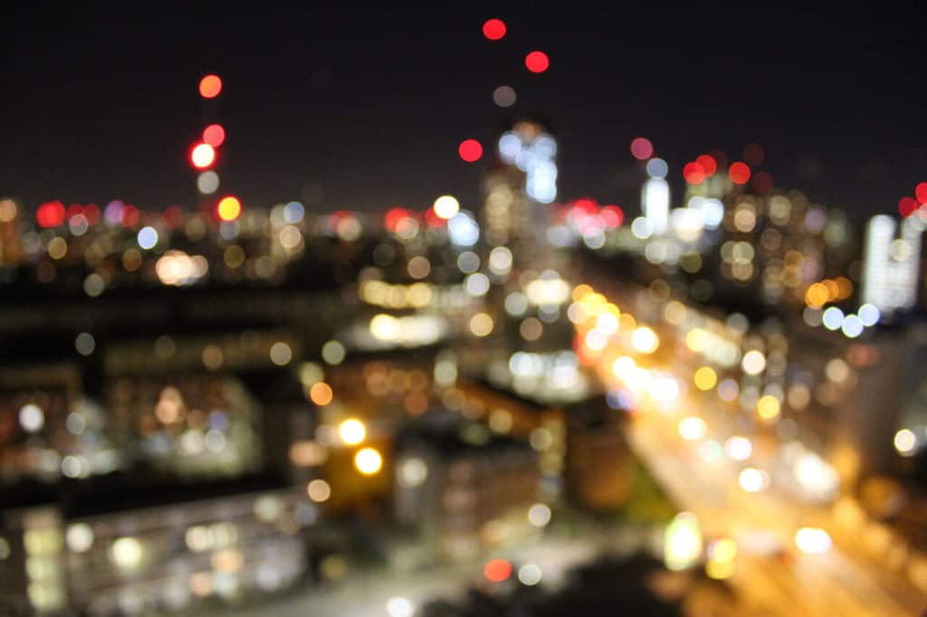 What is Bokeh in Photography? Cityscape defined by blurred points of light.