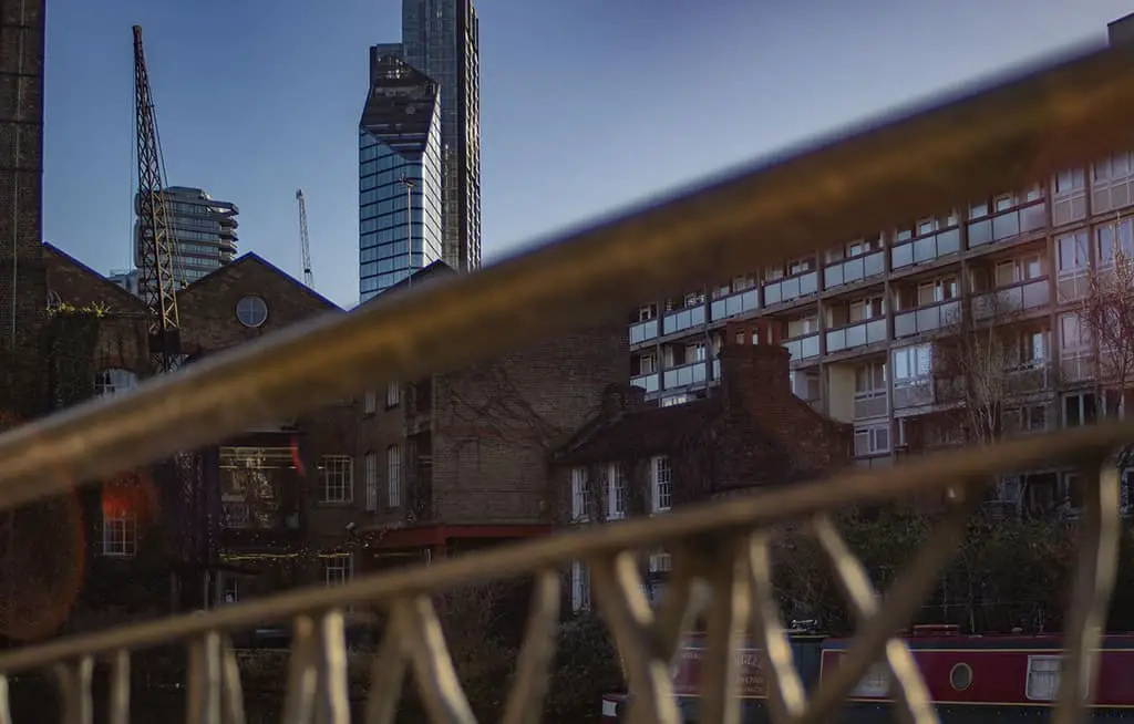 How to Blur Foreground With a DSLR! Galvanised railings and distant tower buildings.