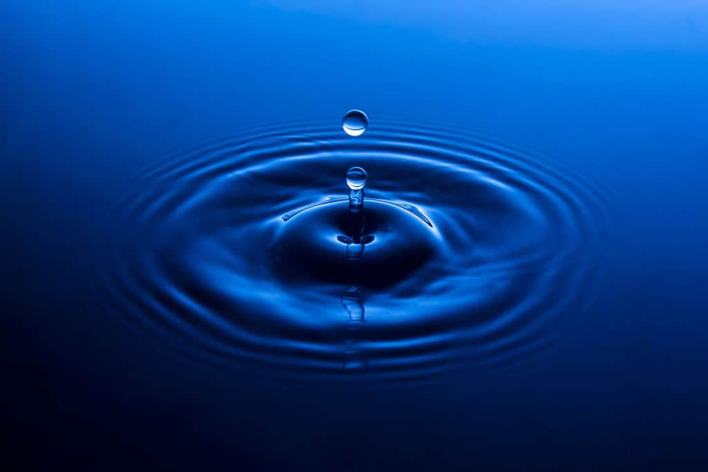 Water Drop Photos, Pro Results on a Budget. Deep blue water drop floating sphere.