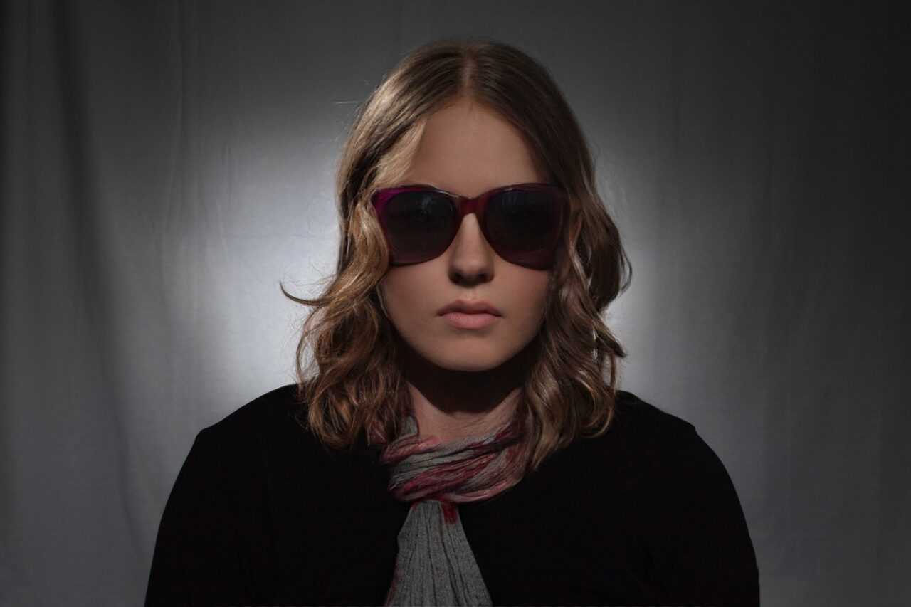 The Complete Guide to Paramount Lighting. Example photo, female with sunglasses.