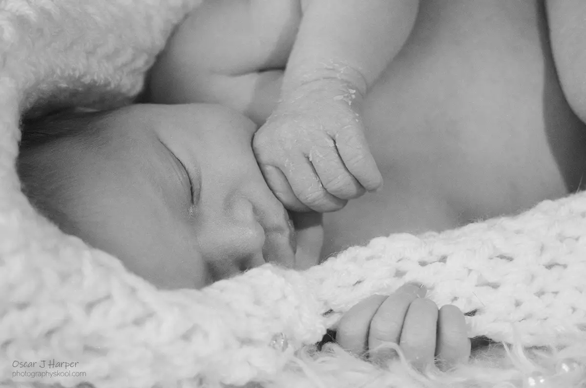 Best Time for Newborn Photos! Face and hand closeup.